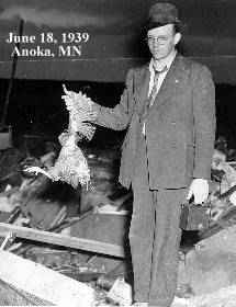 photo of man with dead chicken purportedly plucked of its feathers by the tornado